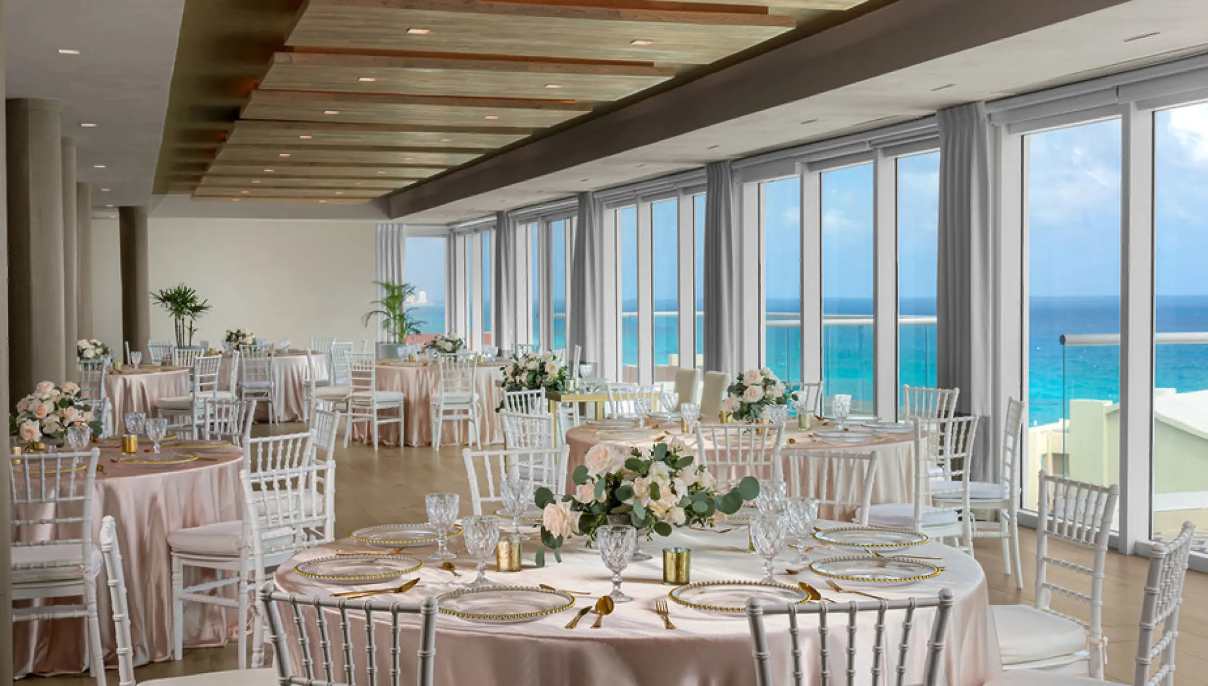 Ballroom wedding reception setup with ocean views at Hilton Cancun Mar Caribe