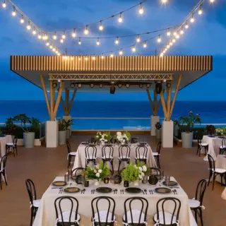 Chala Sky Venue wedding reception with string lights at Hilton Cancun Mar Caribe, Cancun