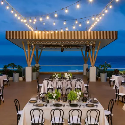 Chala Sky Venue wedding reception with string lights at Hilton Cancun Mar Caribe, Cancun