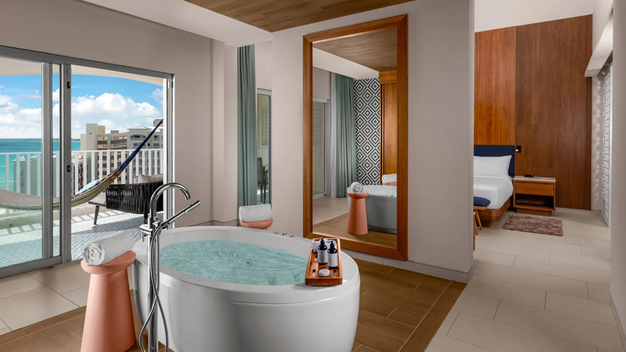Enclave suite with a soaking tub and oceanview balcony at Hilton Cancun Mar Caribe, Cancun