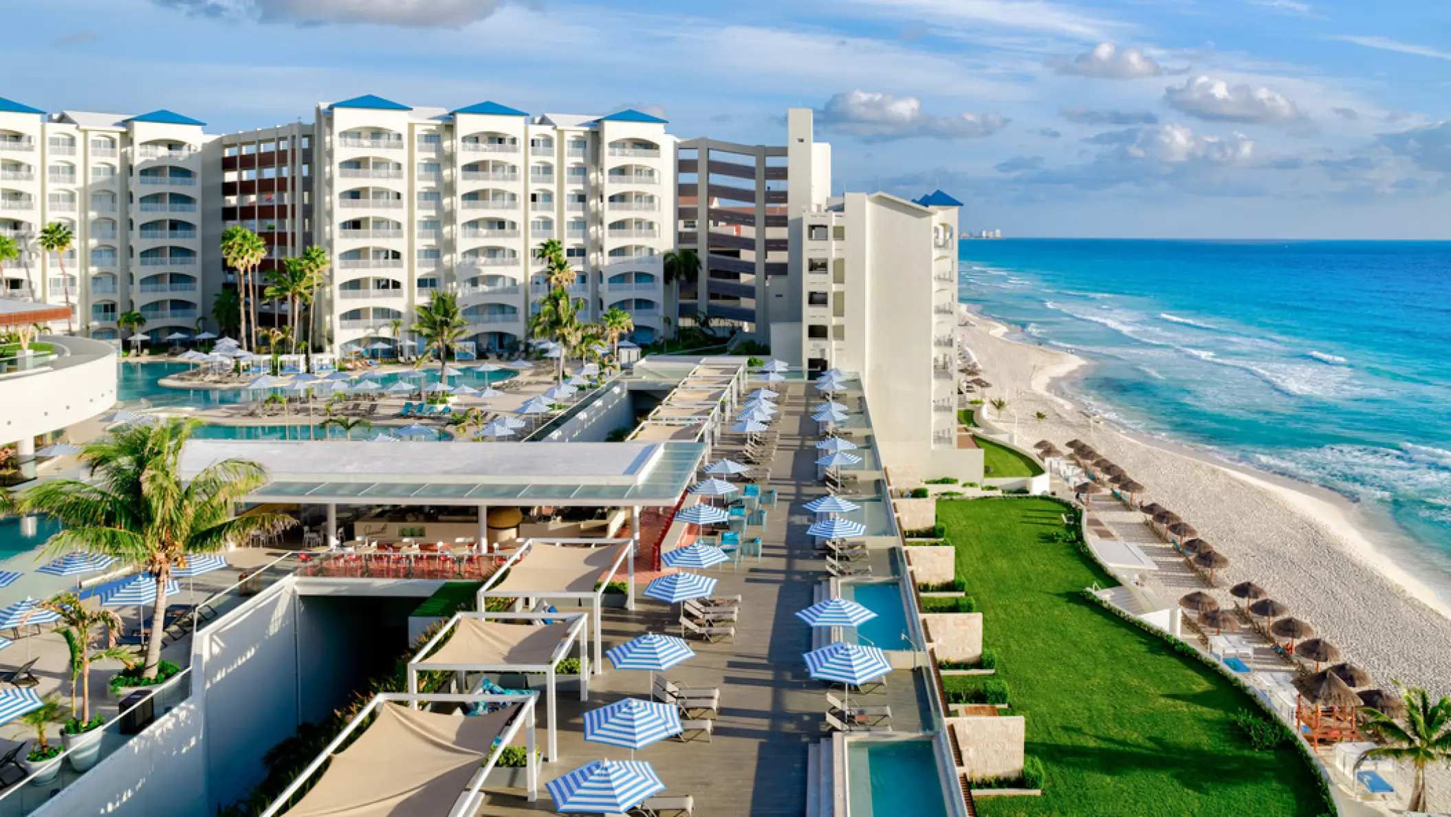 Hilton Cancun Mar Caribe exterior and tiered pool decks overlooking the beach, Cancun