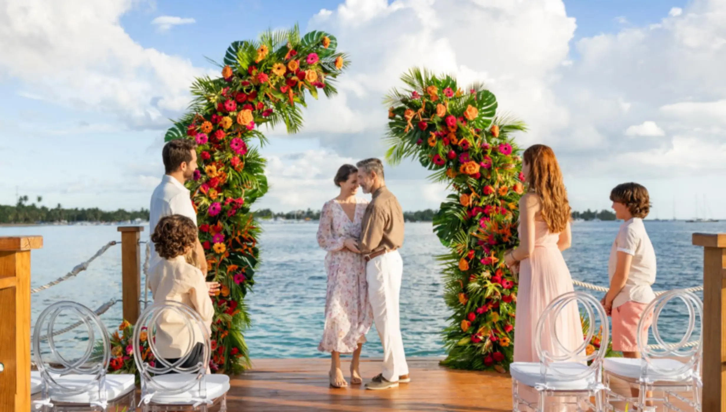 bride, groom, and guests at the pier venue at Dreams La Romana Resort & Spa