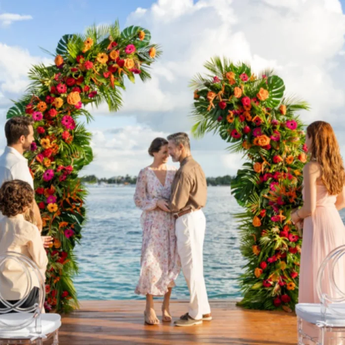 bride, groom, and guests at the pier venue at Dreams La Romana Resort & Spa