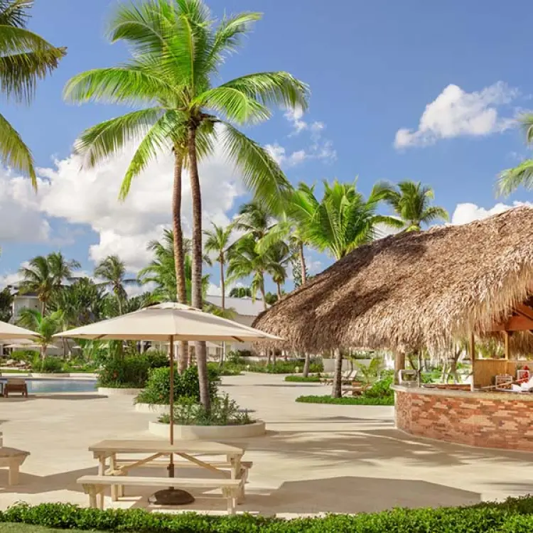 Palapa-style pizzeria and outdoor seating area at Secrets La Romana, La Romana