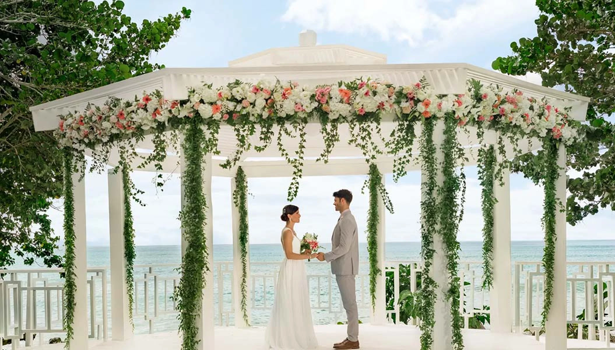 bride and groom at the wedding gazebo at Secrets La Romana Resort & Spa