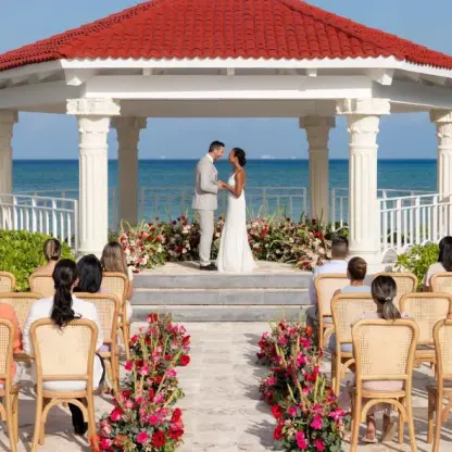 Beachfront wedding ceremony under a white gazebo at Hilton Playa del Carmen