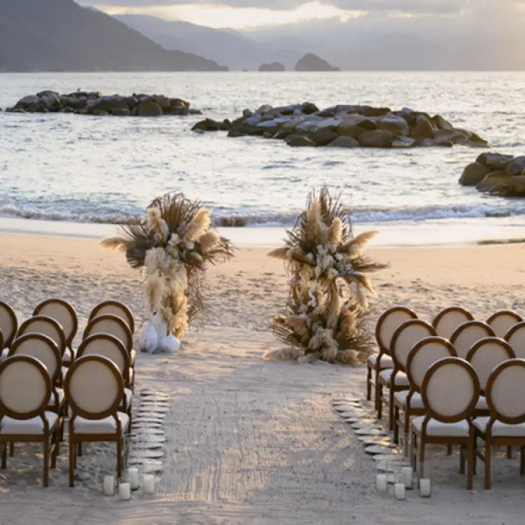 Beach wedding ceremony setup at Hilton Vallarta Riviera, Puerto Vallarta