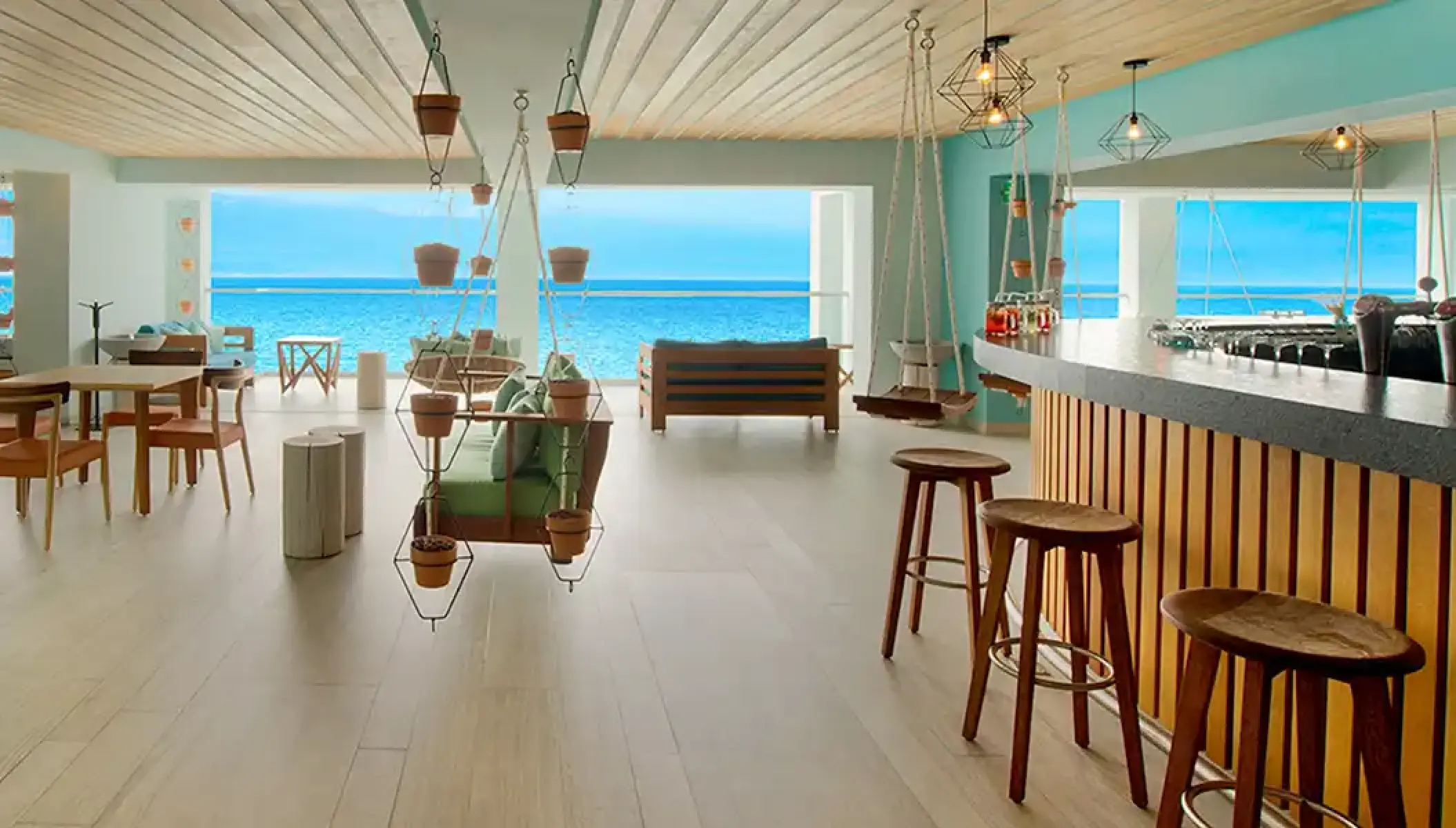 Mojito bar with swing seating and ocean views at Hilton Vallarta Riviera, Puerto Vallarta