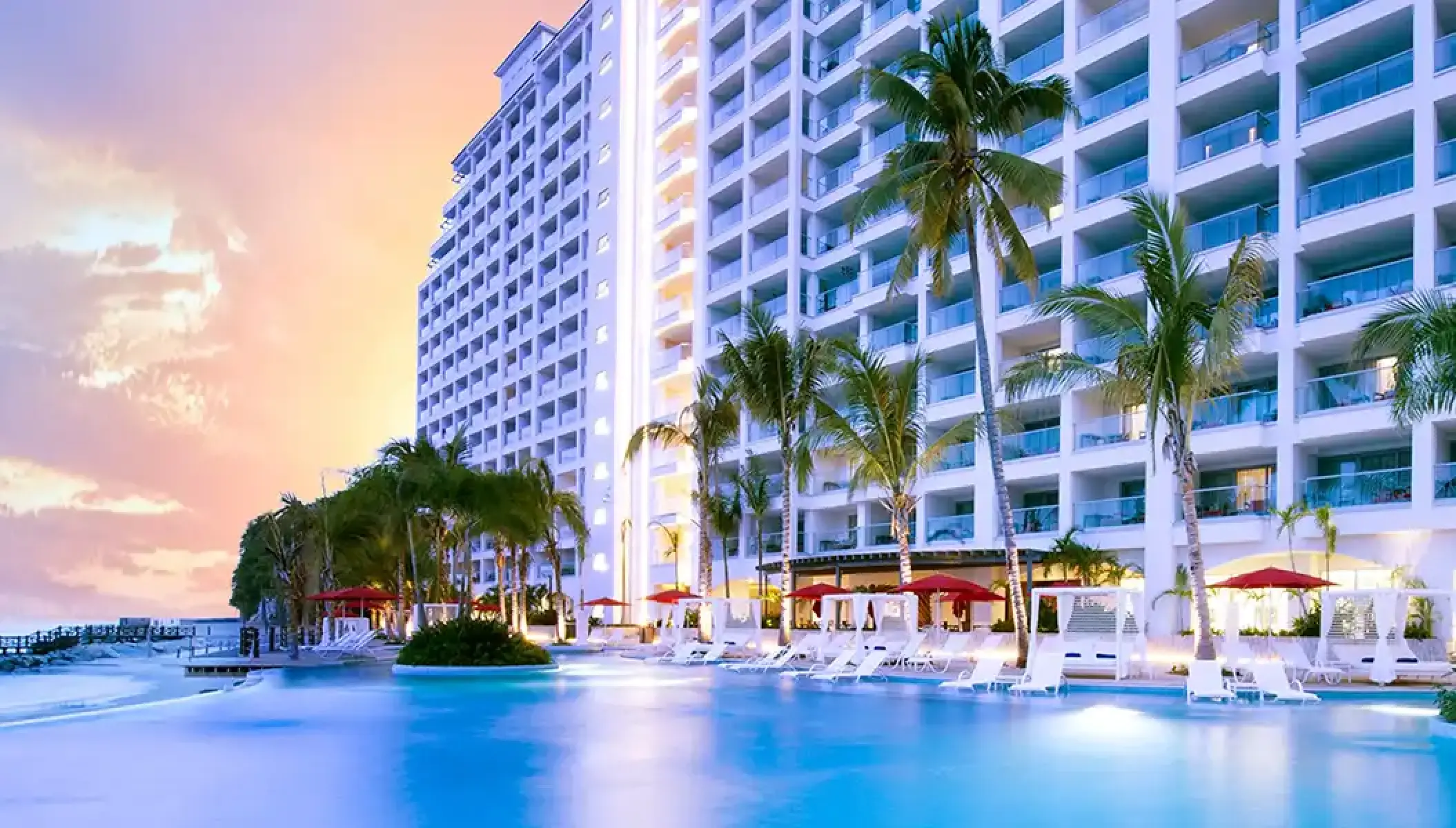 Hilton Vallarta Riviera infinity pool and resort exterior at sunset, Puerto Vallarta