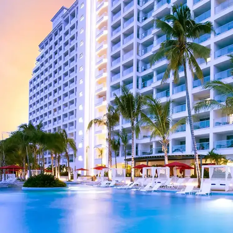 Hilton Vallarta Riviera infinity pool and resort exterior at sunset, Puerto Vallarta