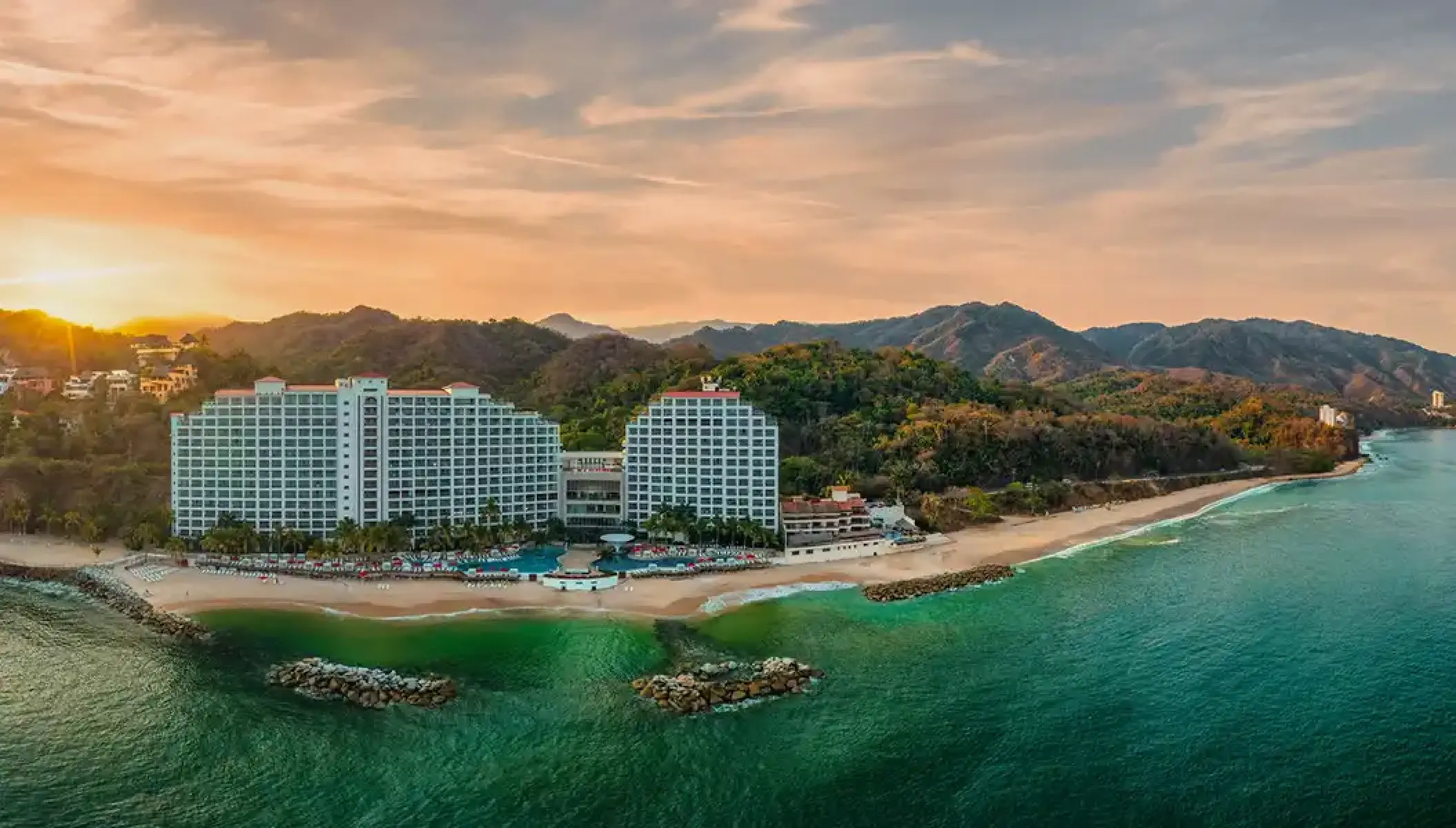 Hilton Vallarta Riviera beachfront exterior at sunset, Puerto Vallarta