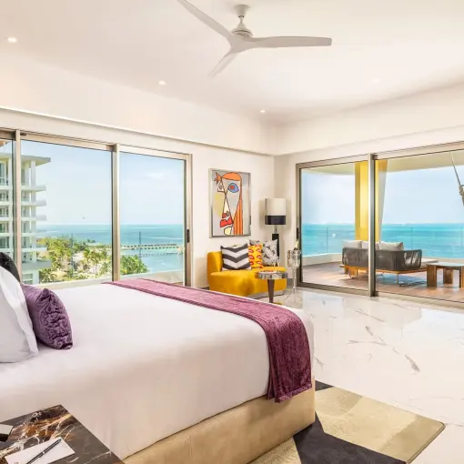 Corner suite at Hotel Mousai Cancun with floor-to-ceiling windows and ocean views, Cancun