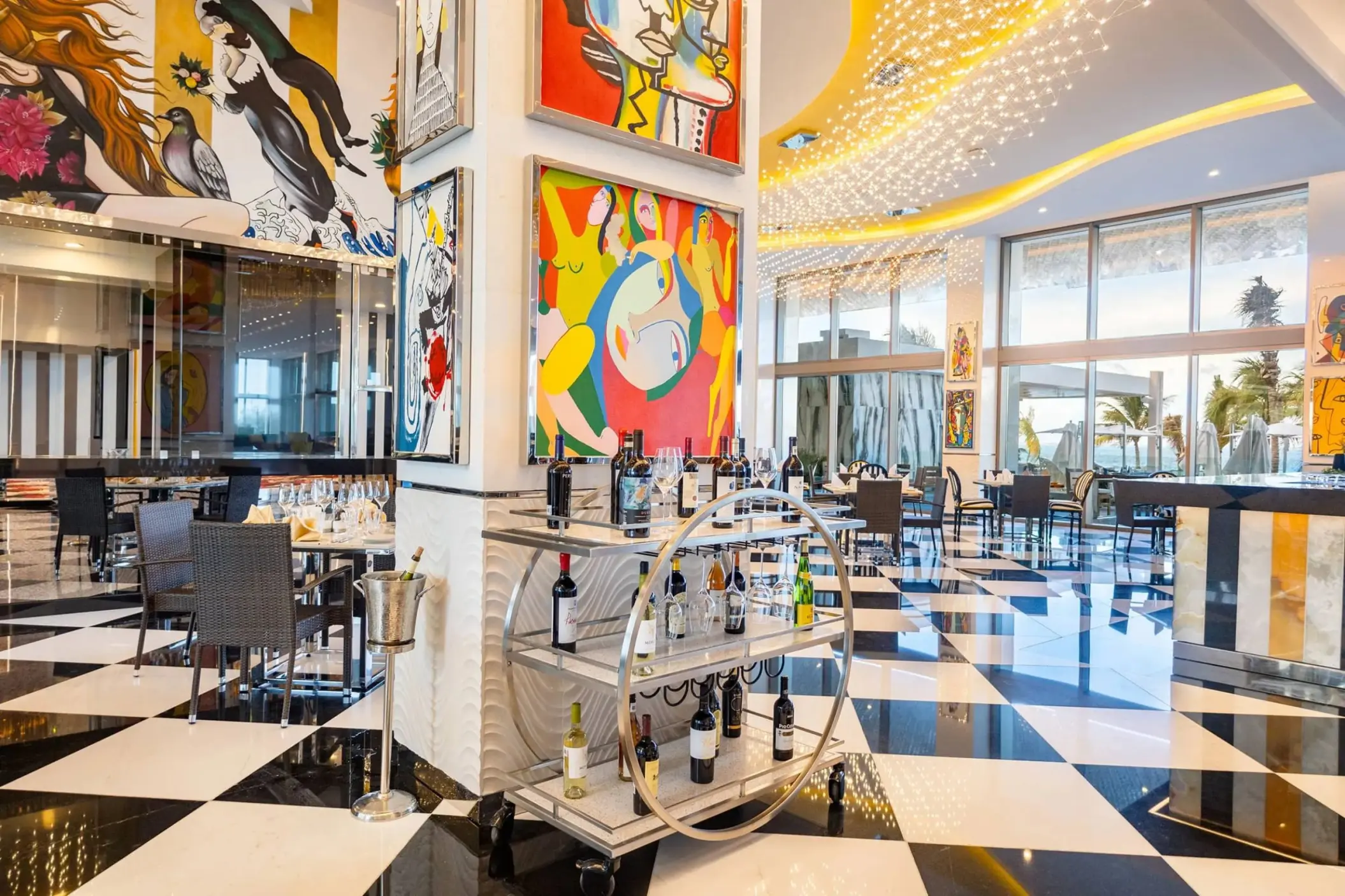 Modern restaurant dining room with pop art and checkered floors at Hotel Mousai Cancun, Cancun