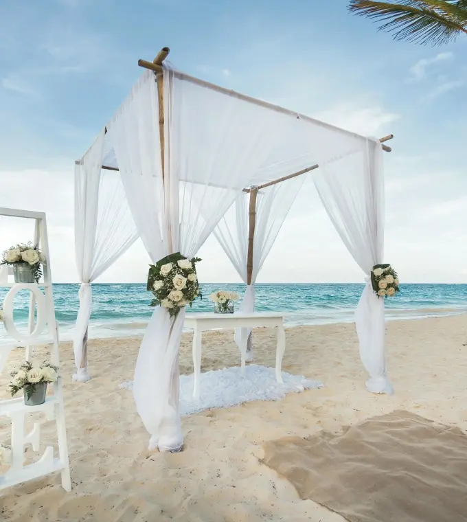 Beachfront wedding ceremony huppah with white draping at Riu Guanacaste, Papagayo
