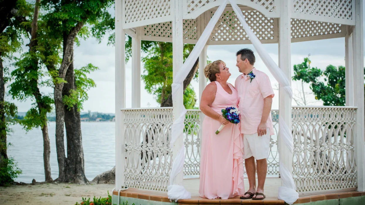 Bride and groom at the beach gazebo venue at Hotel Riu Negril