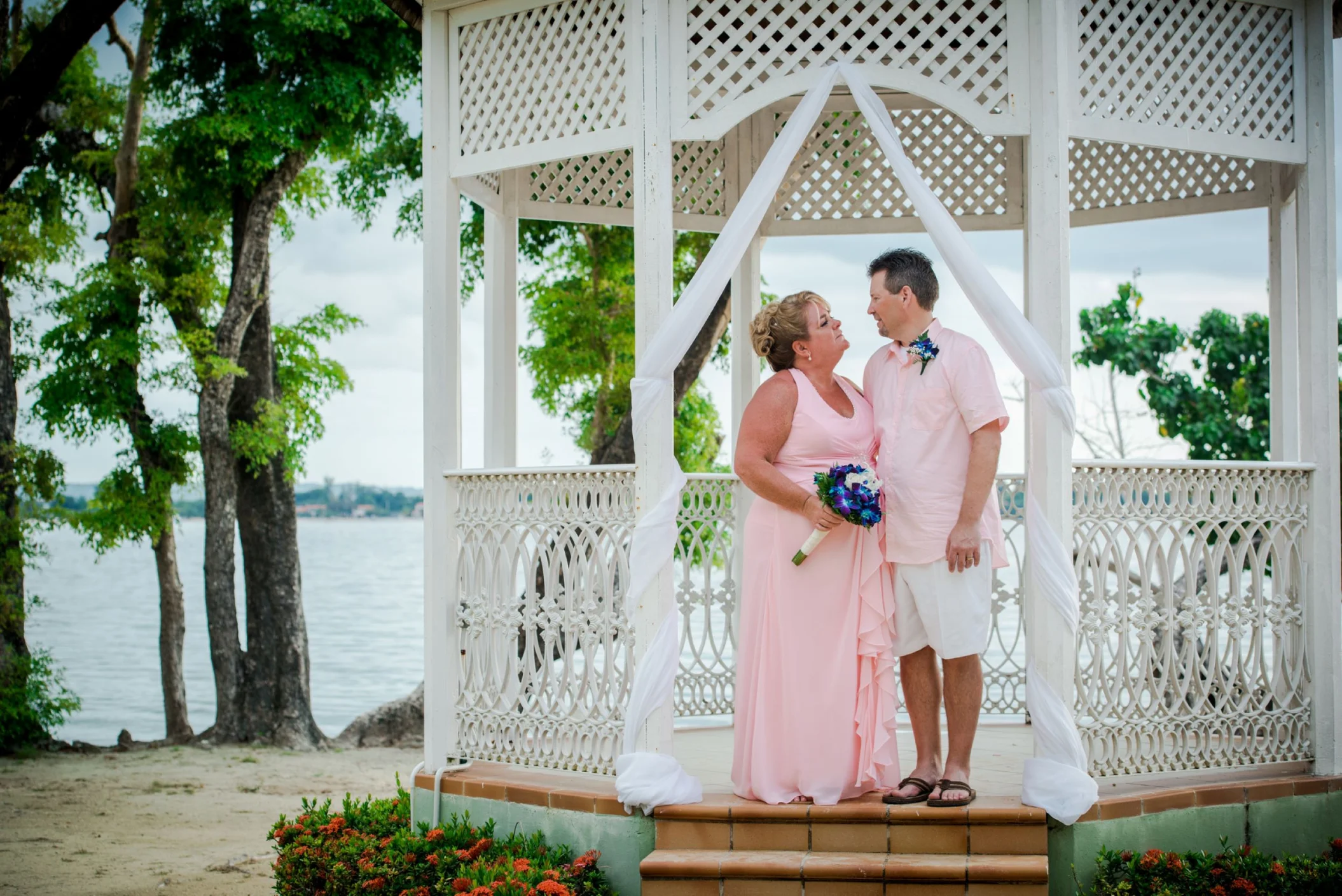 Bride and groom at the beach gazebo venue at Hotel Riu Negril
