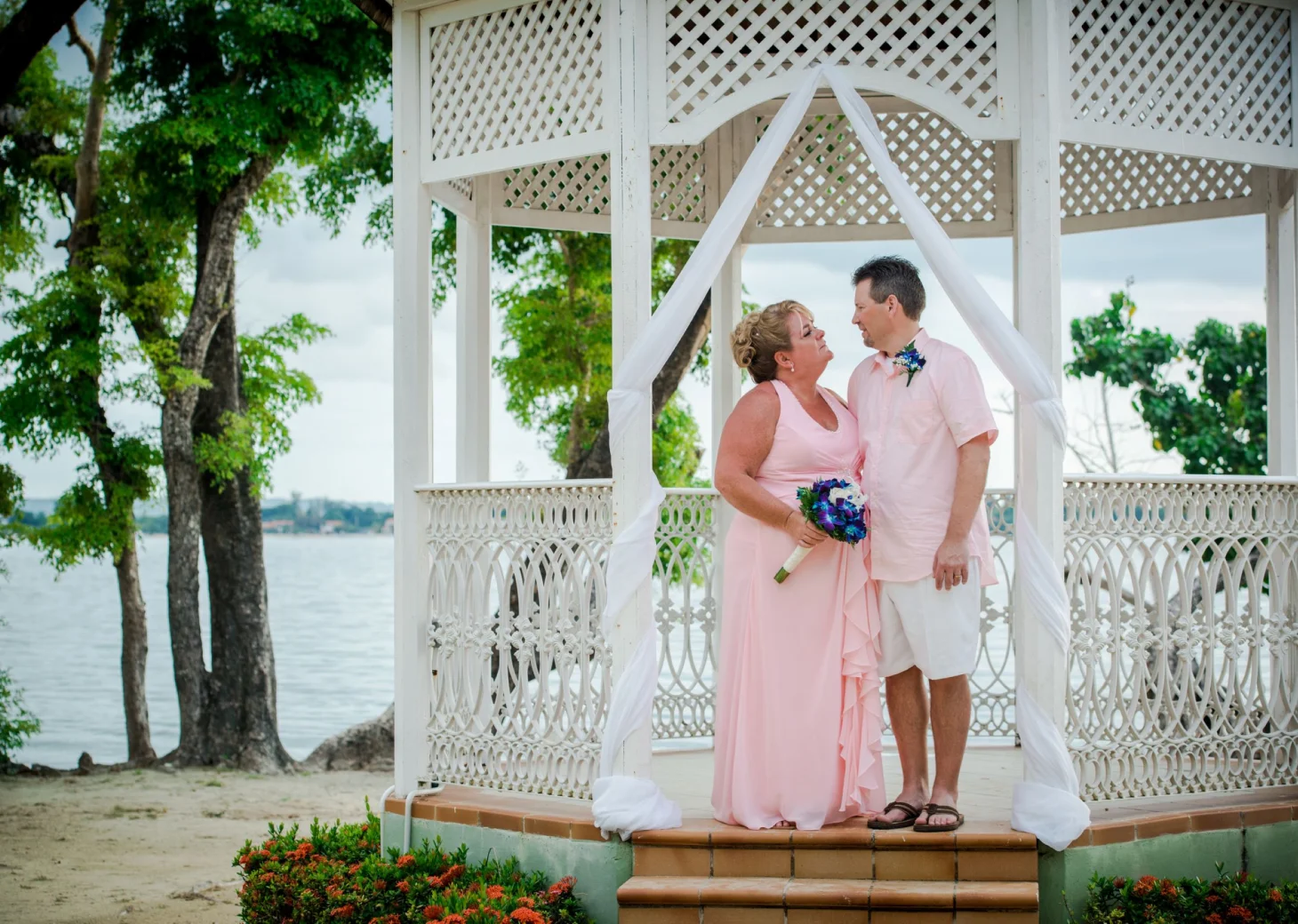 Bride and groom at the beach gazebo venue at Hotel Riu Negril