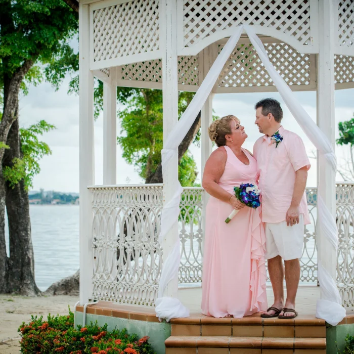 Bride and groom at the beach gazebo venue at Hotel Riu Negril