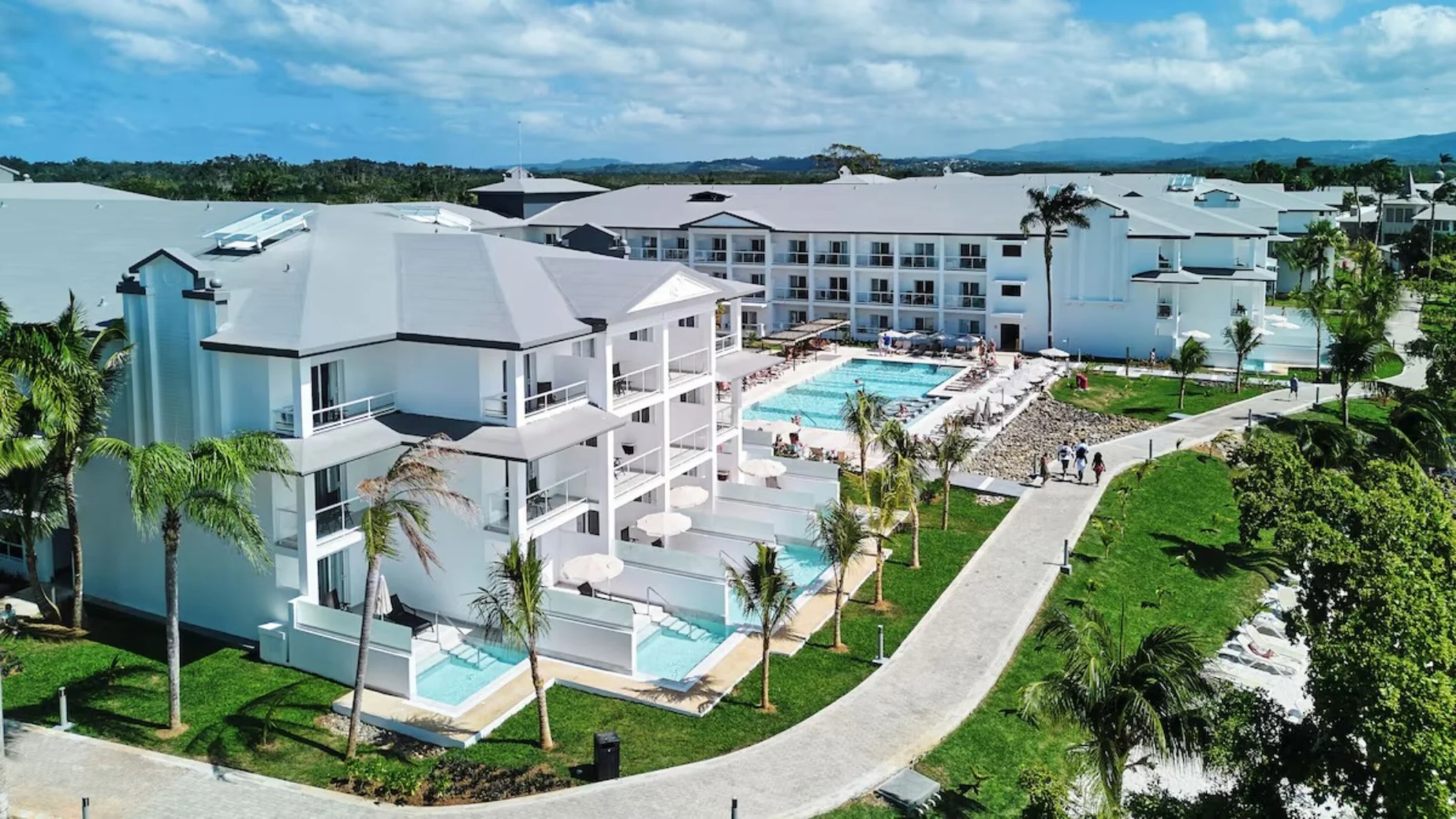 exterior view of the accommodations, swim-out suites, and gardens at Hotel Riu Negril