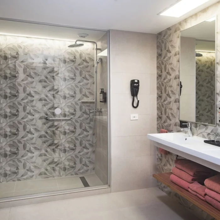 Spacious bathroom with twin vanities of room at Hotel Riu Negril