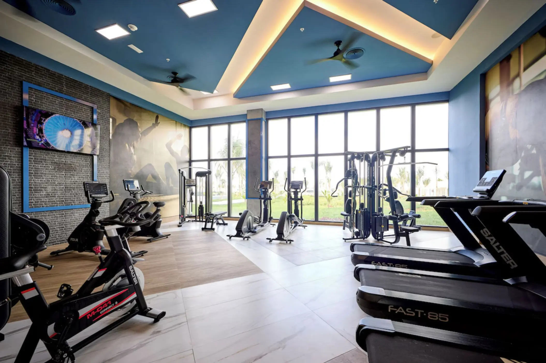 Modern gym with treadmills and exercise bikes at Riu Palace Aquarelle, Montego Bay