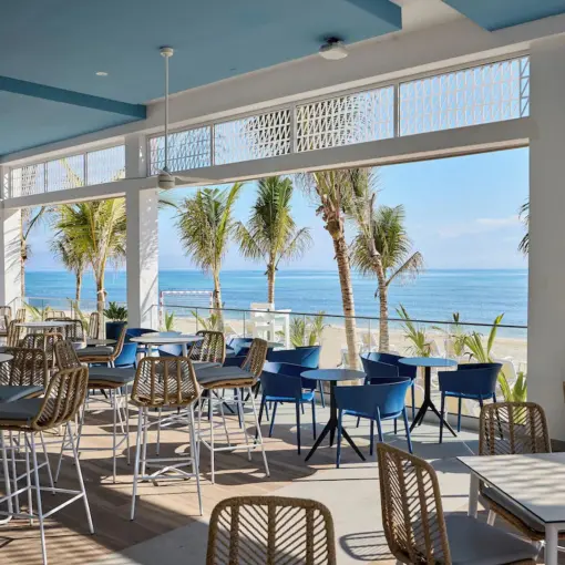 Oceanside restaurant terrace with beach views at Riu Palace Aquarelle, Montego Bay