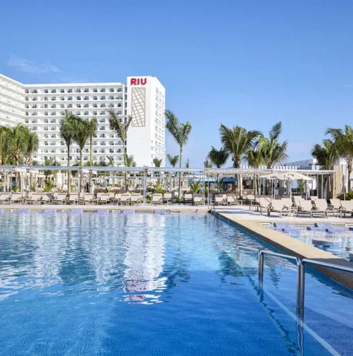 pool and resort building of Riu Palace Aquarelle Hotel