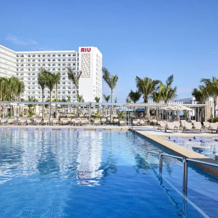 pool and resort building of Riu Palace Aquarelle Hotel