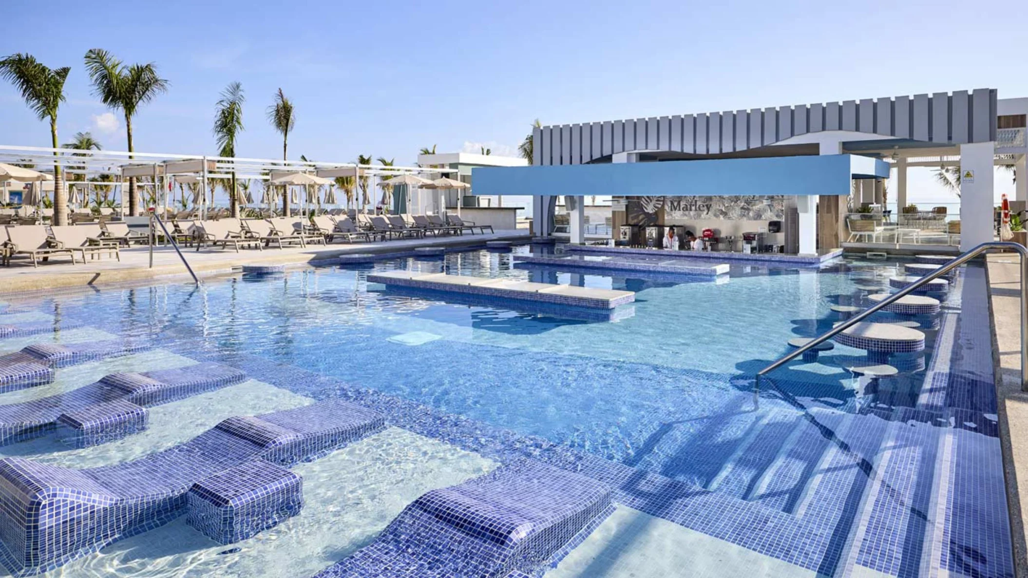 pool with swim up bar at Riu Palace Aquarelle Hotel