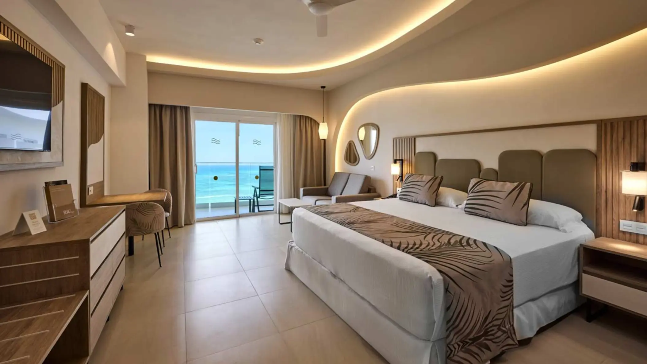 Modern suite with ocean view balcony at Riu Palace Aquarelle, Montego Bay