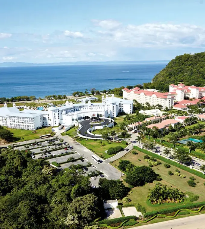 Aerial view of Riu Palace Costa Rica beachfront buildings and lush grounds, Papagayo