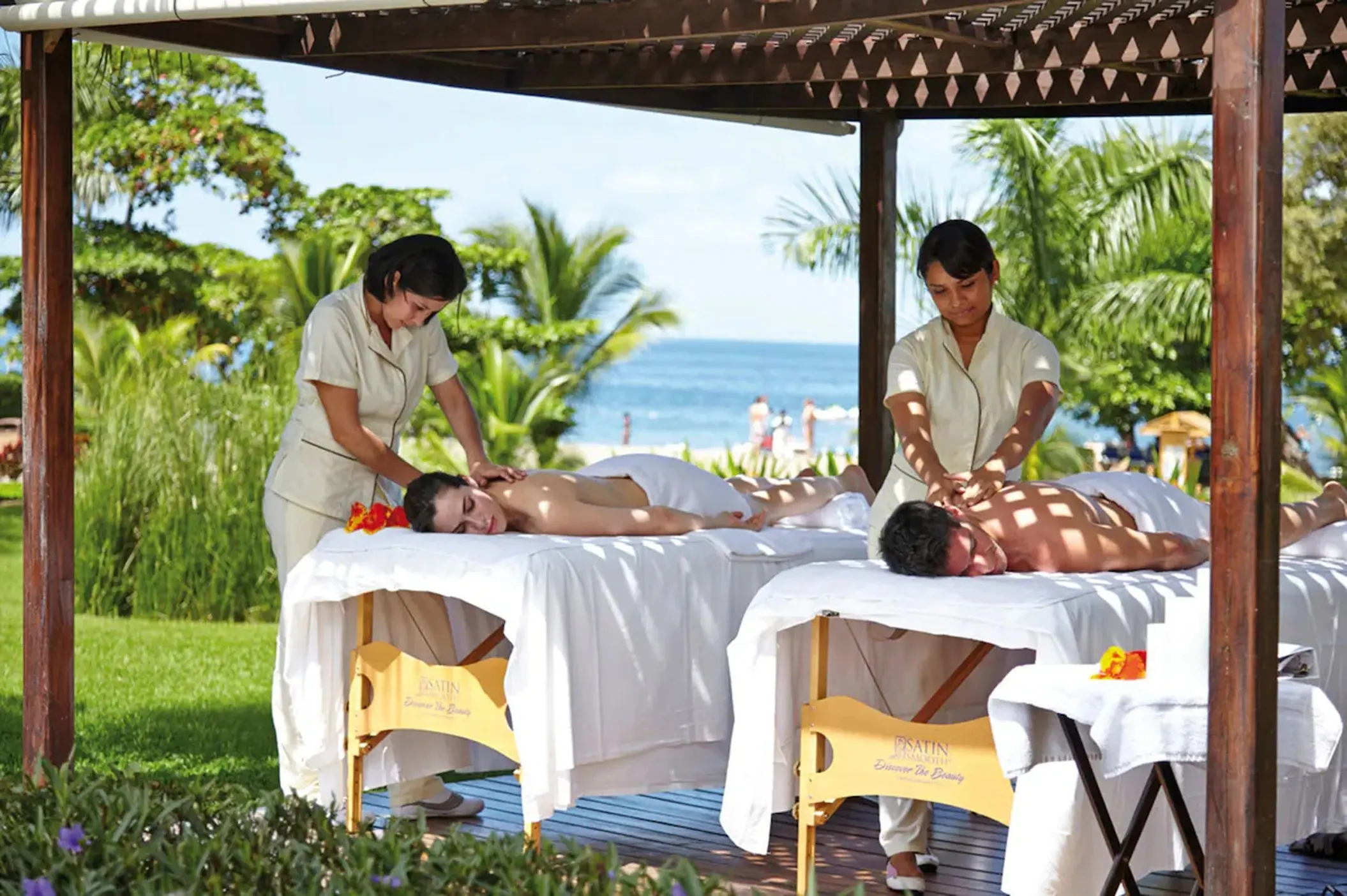 couple enjoying a soothing massage outdoor at the spa at Hotel Riu Palace Costa Rica