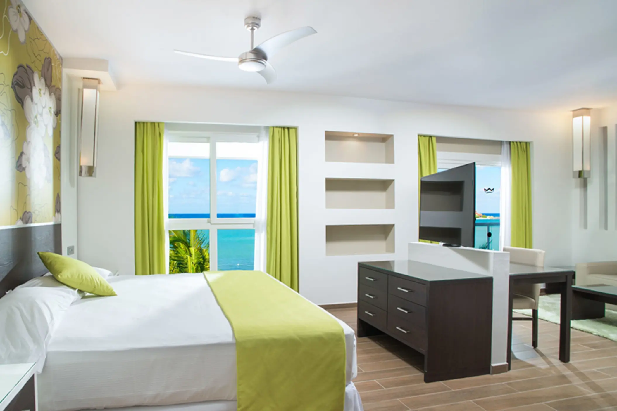 Junior suite with ocean views and lime green accents at Hotel Riu Reggae, Montego Bay