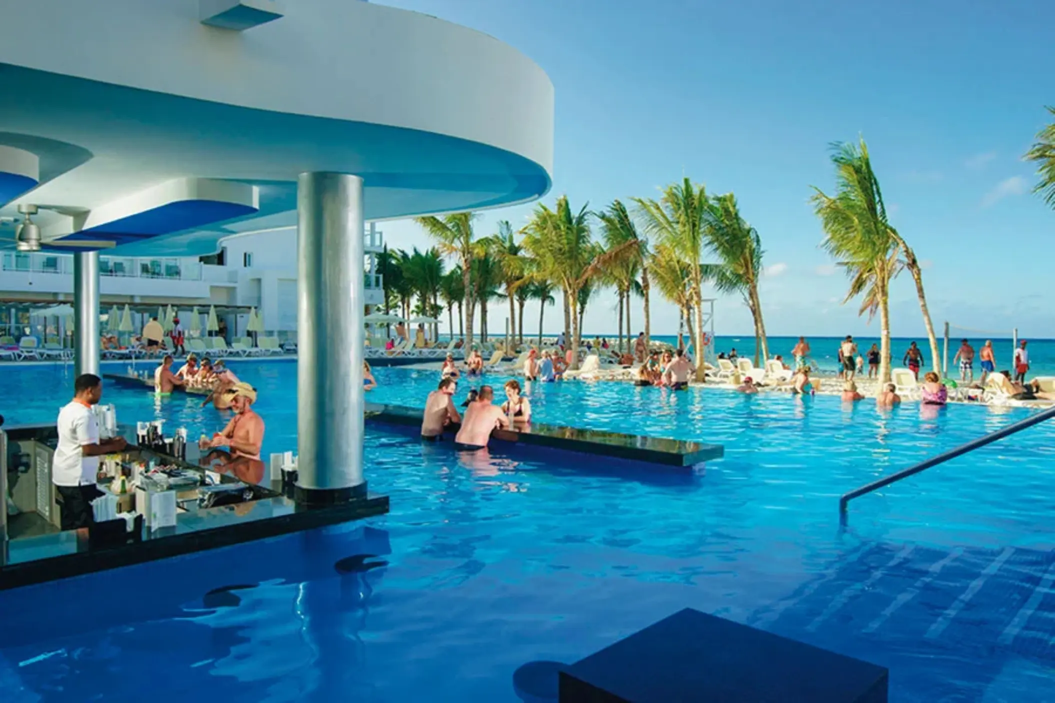 Guests at the swim-up bar in the infinity pool at Riu Reggae, Montego Bay
