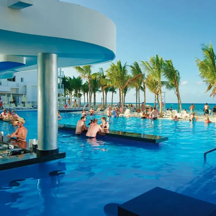 Guests at the swim-up bar in the infinity pool at Riu Reggae, Montego Bay