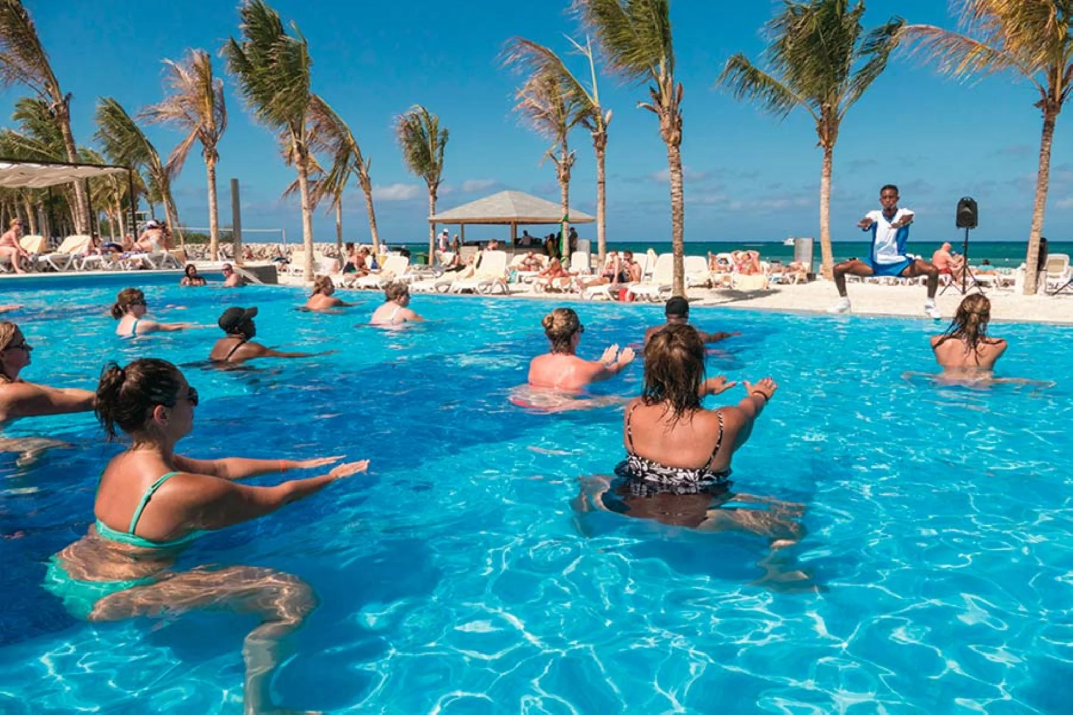 people enjoying aqua aerobics at the oceanfront pool at Hotel Riu Reggae