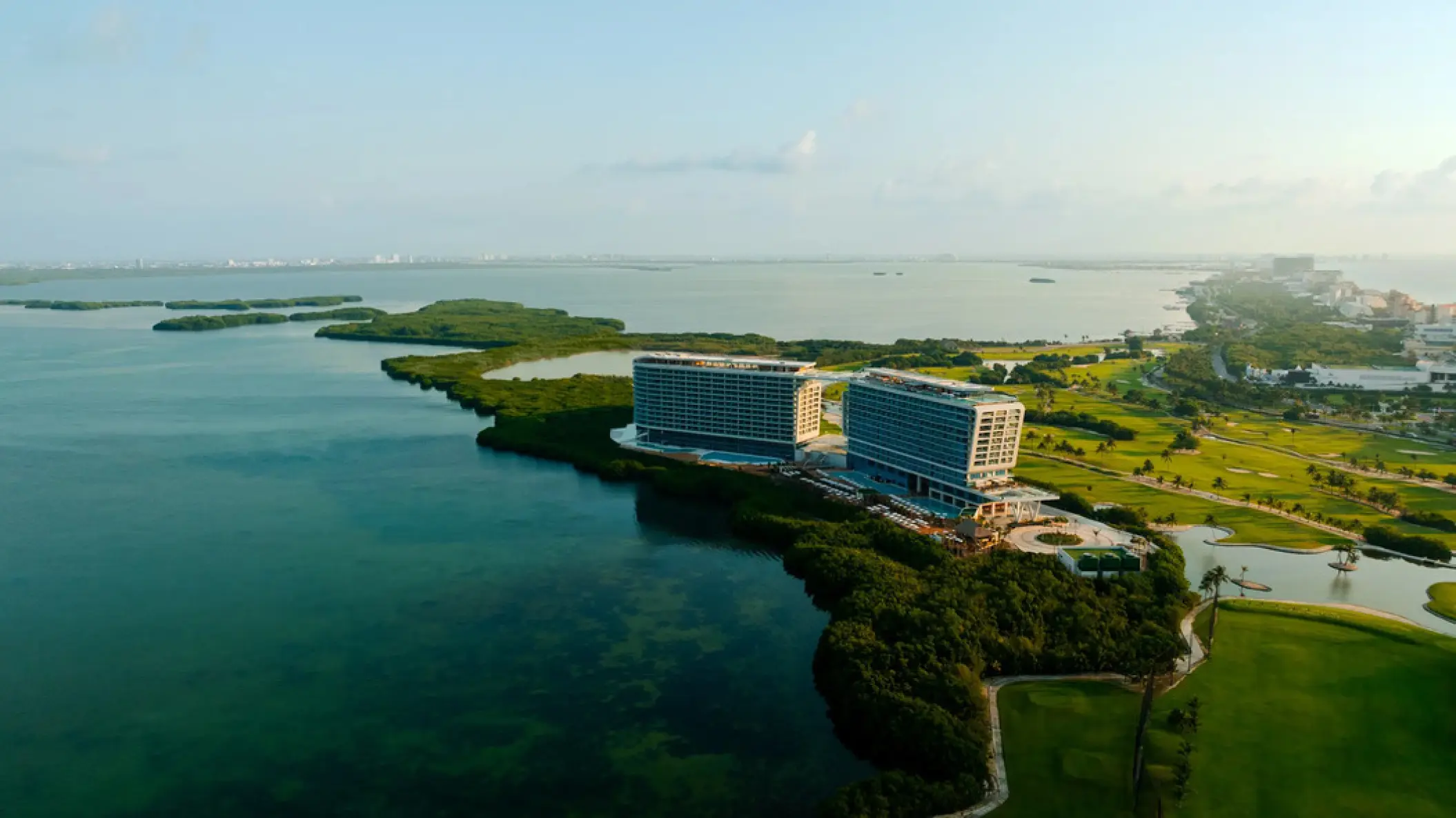 Aerial view of Hyatt Vivid Grand Island between the Nichupté Lagoon and mangroves, Cancun