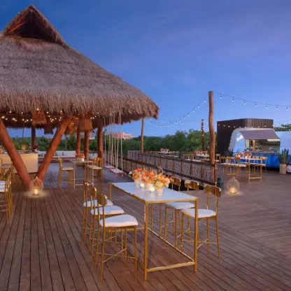 Amber Bar and Vivid Bites cocktail setup on the wooden deck at Hyatt Vivid Grand Island, Cancun