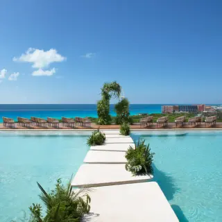 Rooftop wedding ceremony venue with pool aisle and ocean views at Hyatt Vivid Grand Island, Cancun