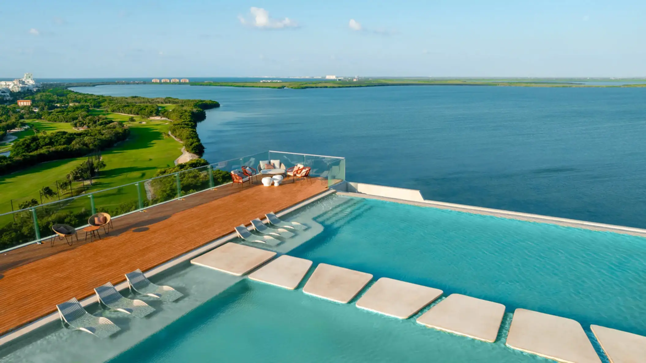 Rooftop infinity pool and sun loungers overlooking the Nichupté Lagoon at Hyatt Vivid Grand Island, Cancun
