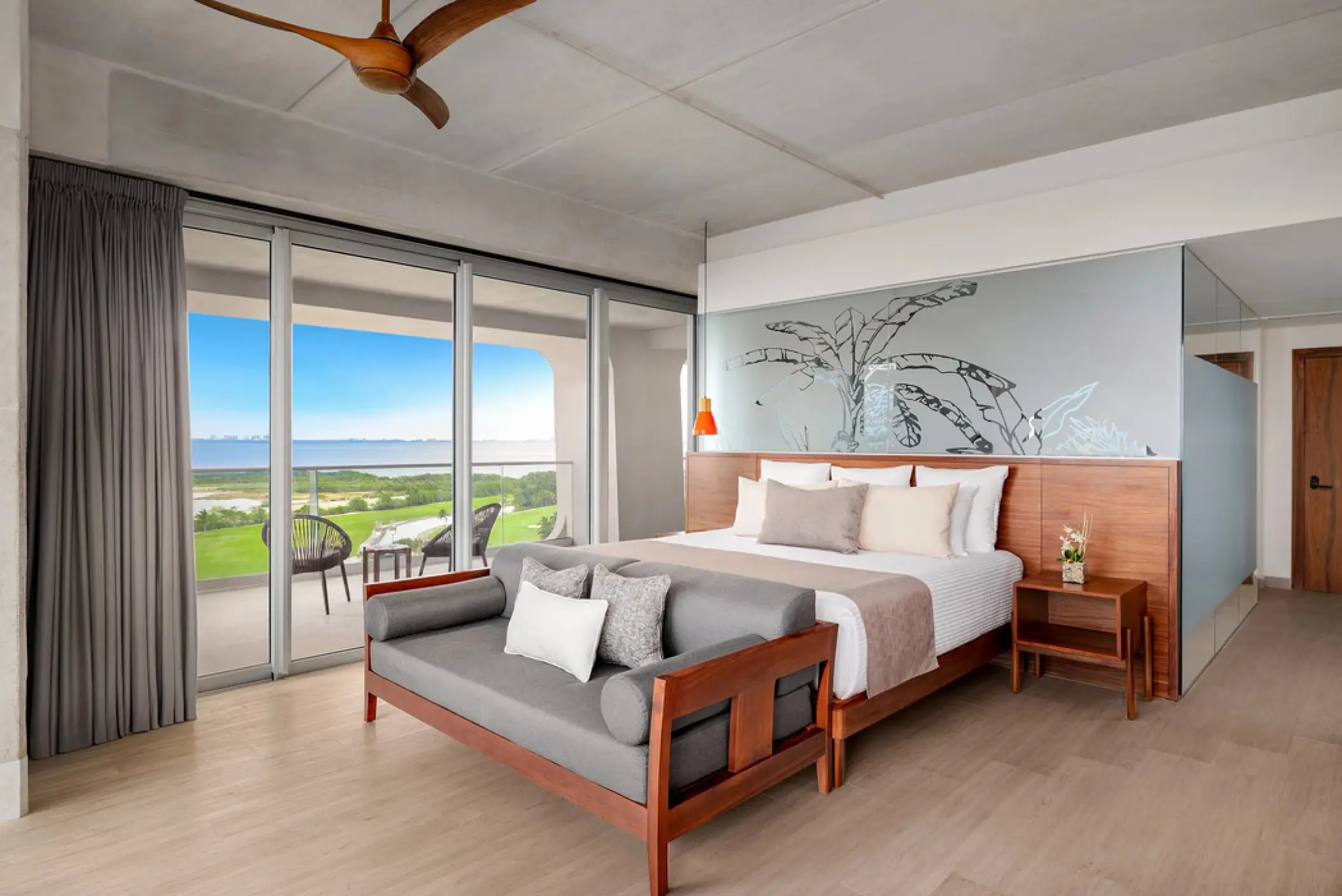 Vantage Club corner suite with floor-to-ceiling windows at Hyatt Vivid Grand Island, Cancun