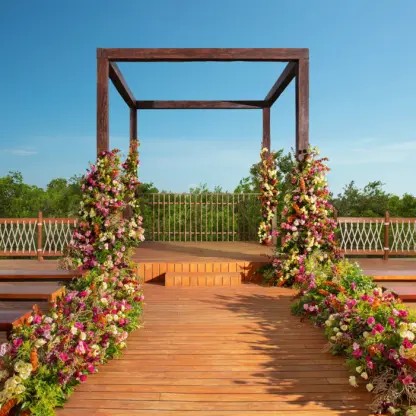 Wooden rooftop wedding ceremony gazebo with floral arrangements at Hyatt Vivid Grand Island, Cancun
