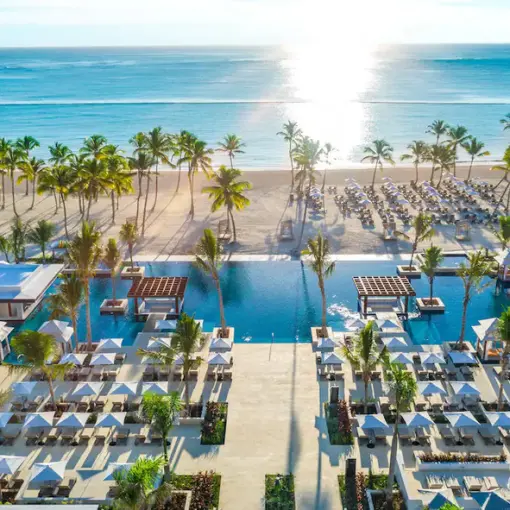 Aerial view of cabanas, swimming pools, and the beach at Hyatt Zilara Cap Cana, Punta Cana