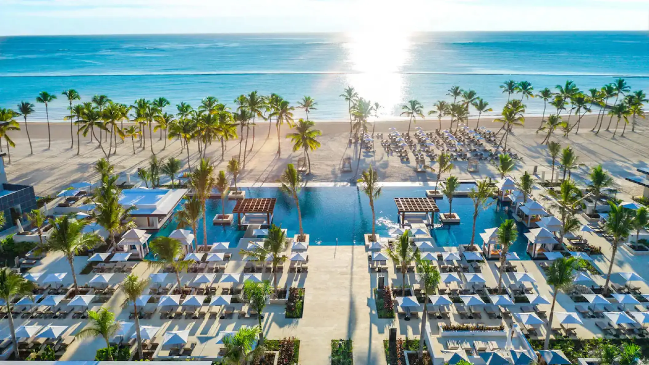 Aerial view of cabanas, swimming pools, and the beach at Hyatt Zilara Cap Cana, Punta Cana