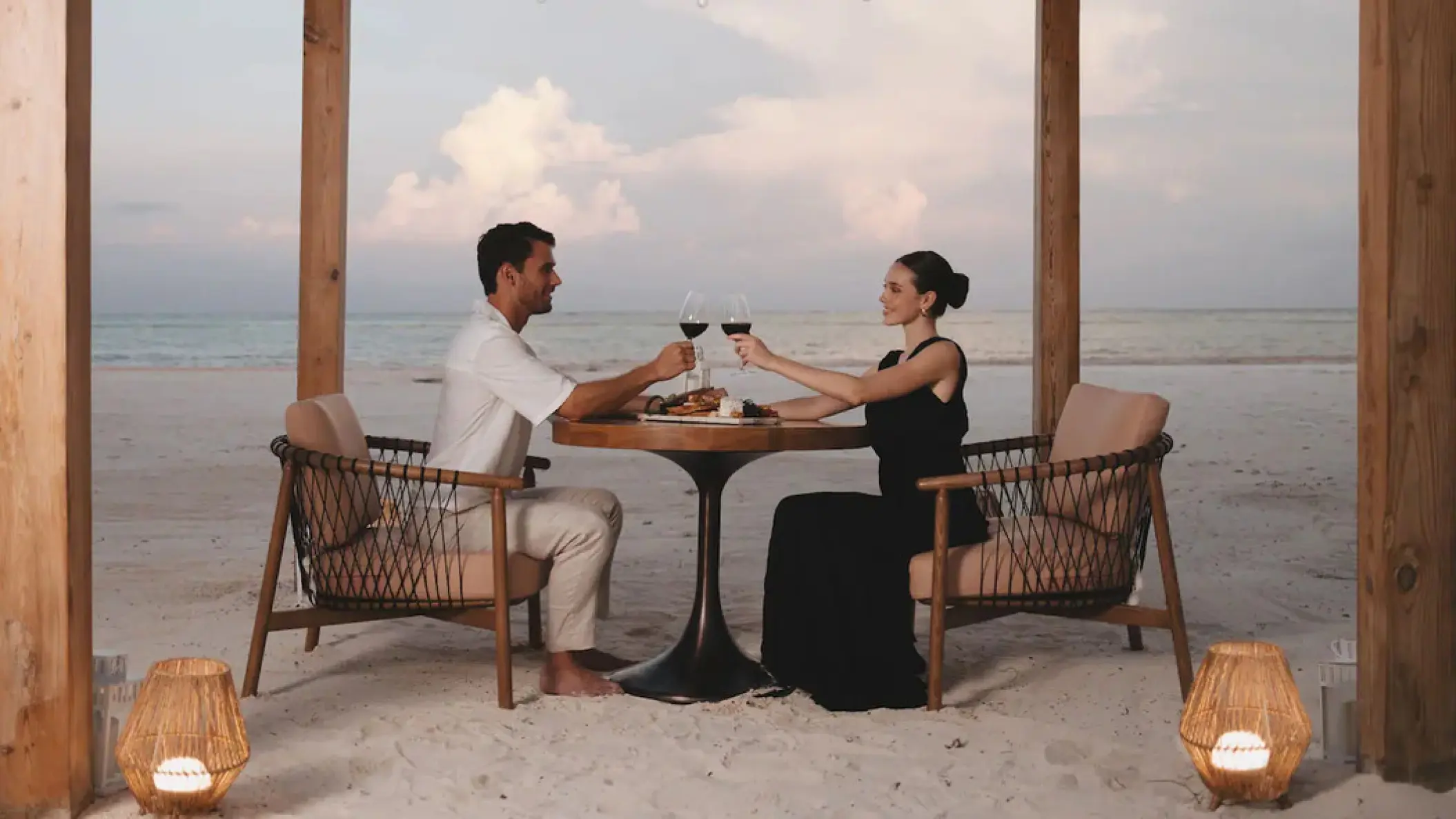 Couple enjoying a private beach dinner at Hyatt Zilara Cap Cana, Punta Cana