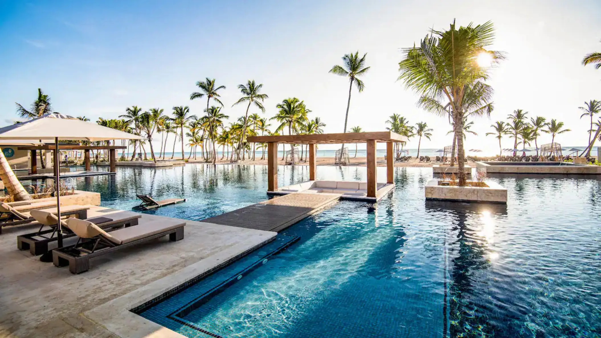Pool with lounge chairs and cabanas at Hyatt Zilara Cap Cana, Punta Cana
