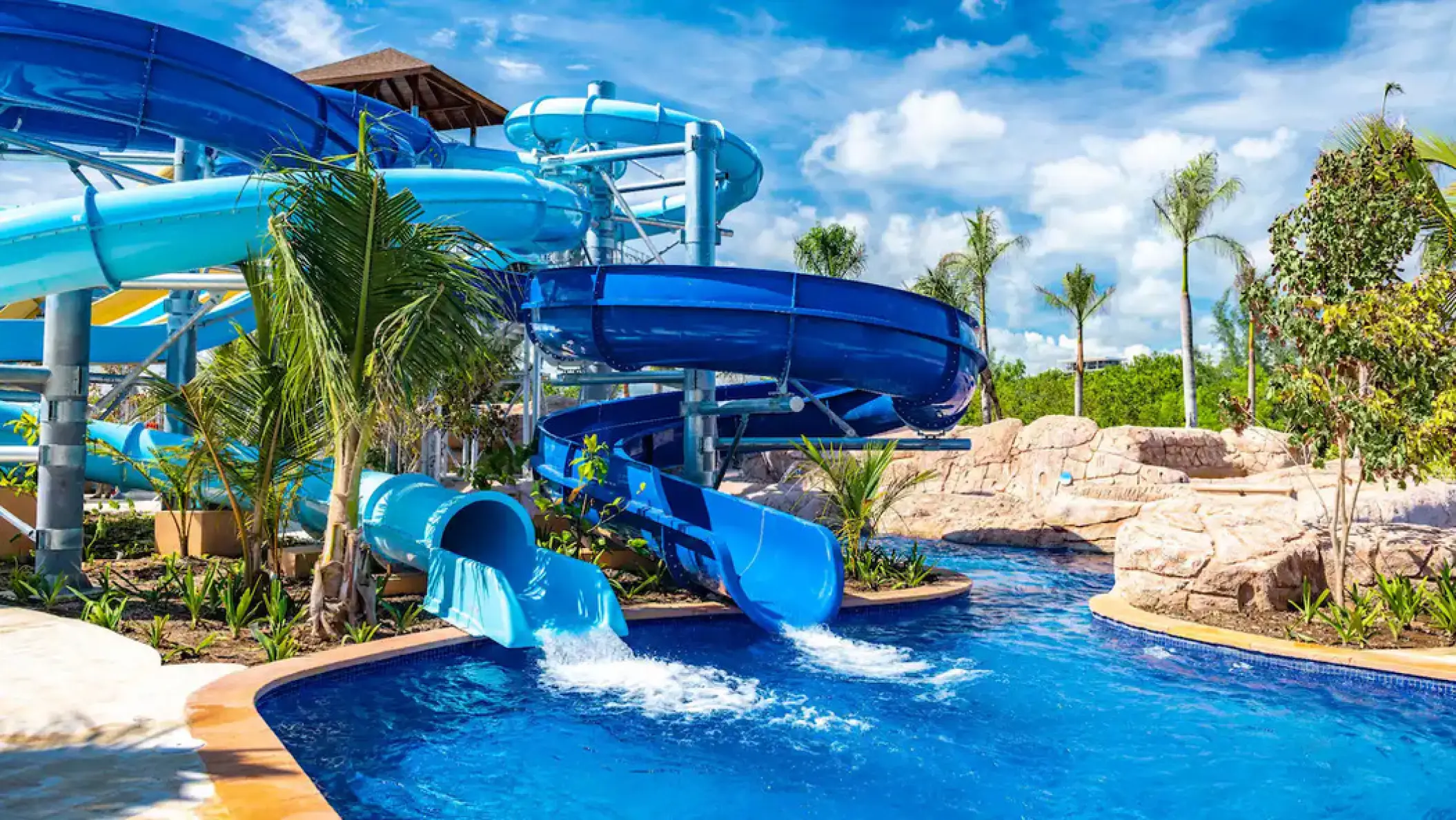 Winding blue water slides at the Hyatt Zilara Cap Cana waterpark, Punta Cana