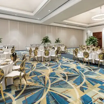 Indoor wedding reception setup with gold chairs and tropical greenery at Hyatt Zilara Rose Hall, Montego Bay