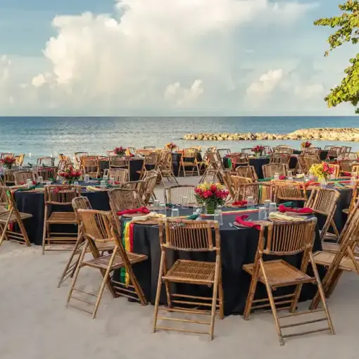Beachfront wedding reception setup with bamboo chairs at Hyatt Zilara Rose Hall, Montego Bay