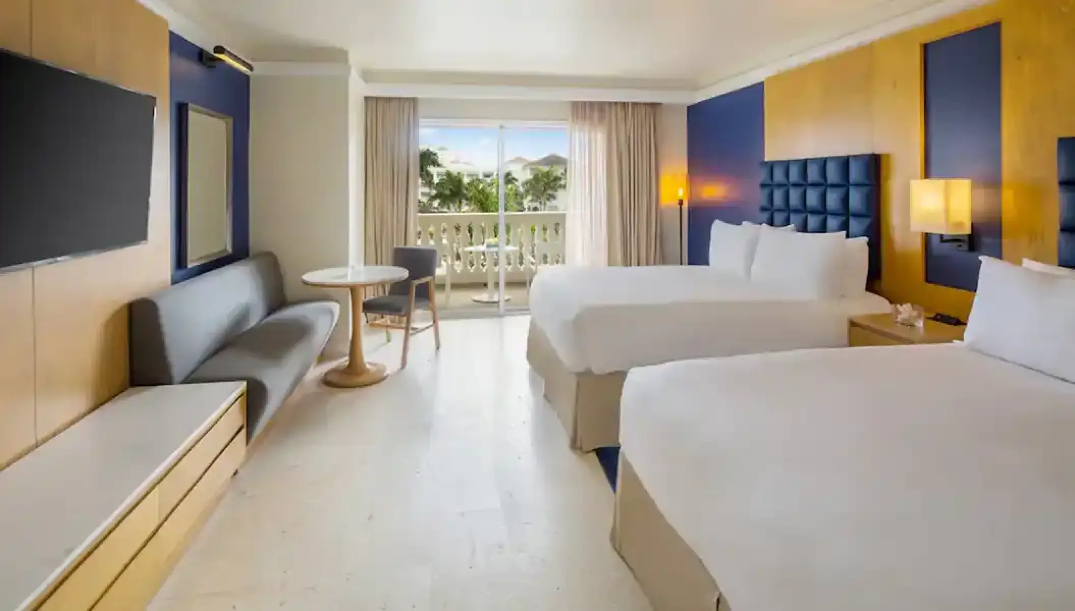 Modern suite with two beds and a private balcony at Hyatt Zilara Rose Hall, Montego Bay